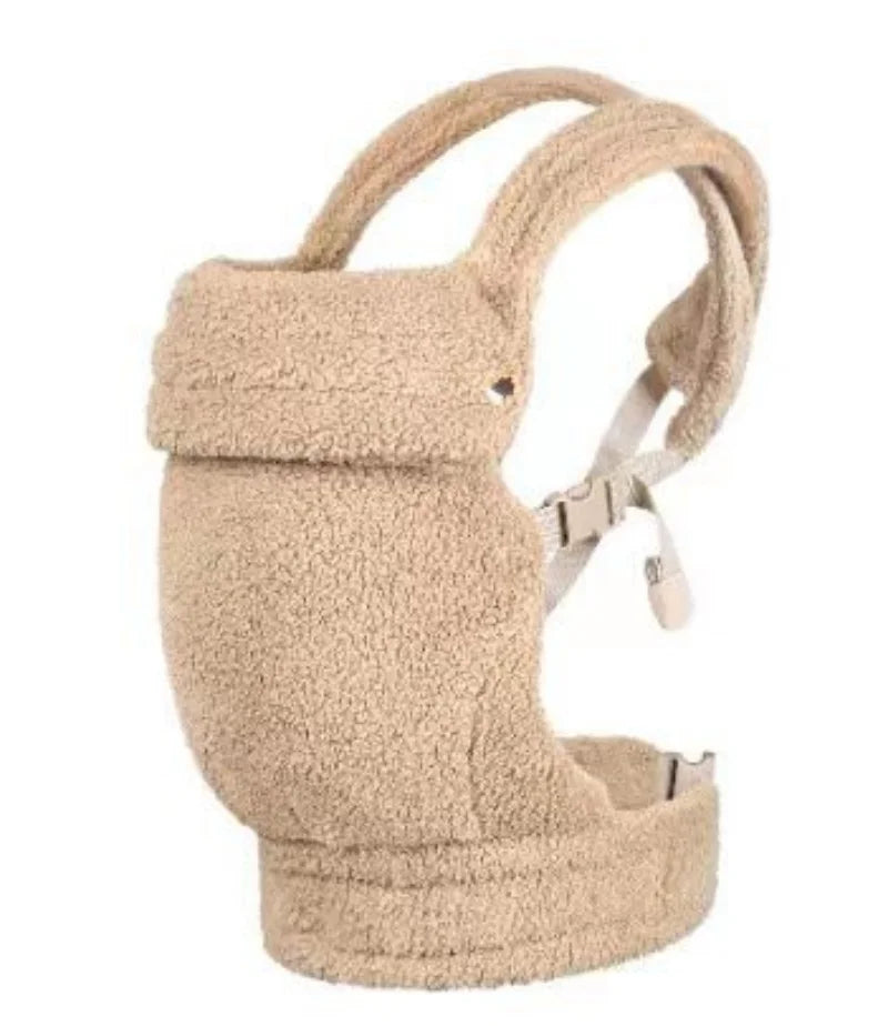 Porte-bébé ventral et dorsal kaki porté sur le ventre